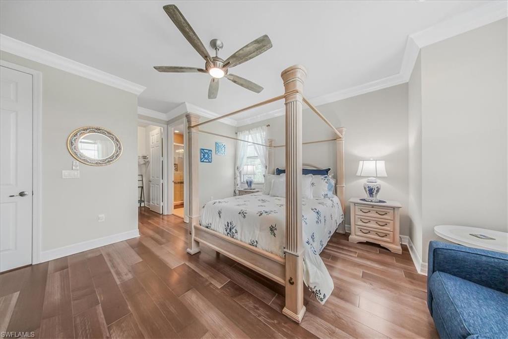 4616 Azalea Drive Naples, FL 34119 - Photo 18 of 44 Bedroom with wood finished floors, crown molding, ceiling fan, and ensuite bathroom