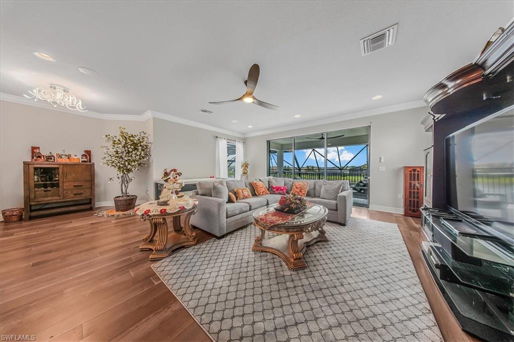 4616 Azalea Drive Naples, FL 34119 - Photo 20 of 44 Living room with ornamental molding, light wood finished floors, ceiling fan, and recessed lighting
