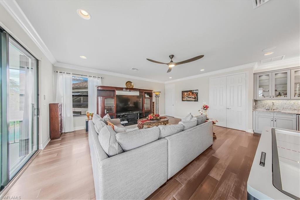 4616 Azalea Drive Naples, FL 34119 - Photo 21 of 44 Living room with crown molding, dark wood finished floors, recessed lighting, and a ceiling fan