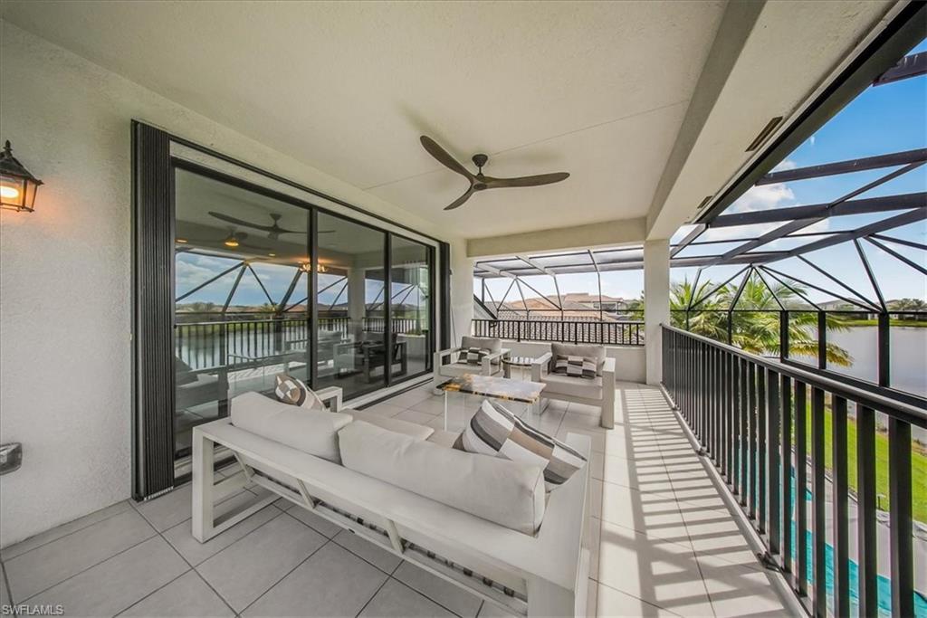 4616 Azalea Drive Naples, FL 34119 - Photo 23 of 44 Sunroom featuring an outdoor hangout area, a water view, plenty of natural light, and a ceiling fan