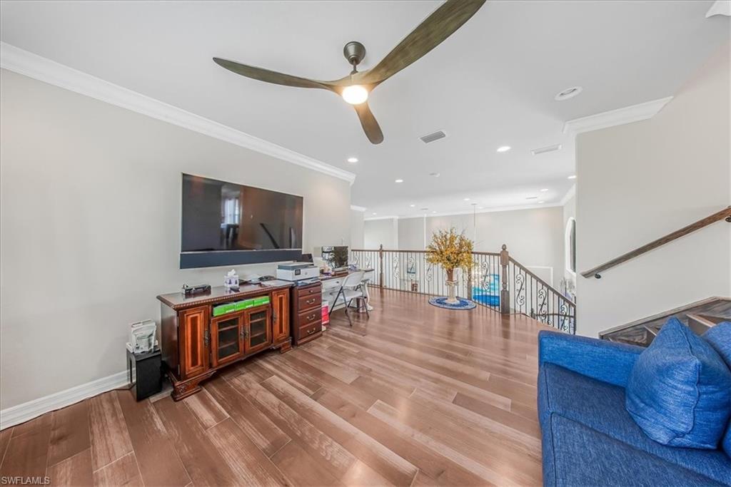 4616 Azalea Drive Naples, FL 34119 - Photo 27 of 44 Living area featuring ornamental molding, light wood finished floors, recessed lighting, and ceiling fan