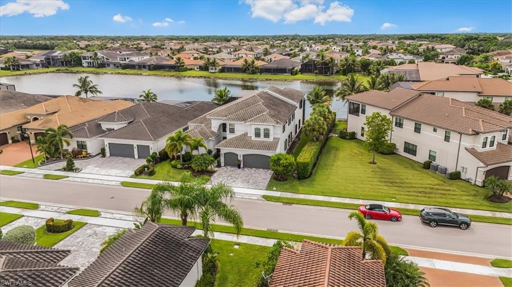 4616 Azalea Drive Naples, FL 34119 - Photo 33 of 44 Aerial view of residential area with a nearby body of water