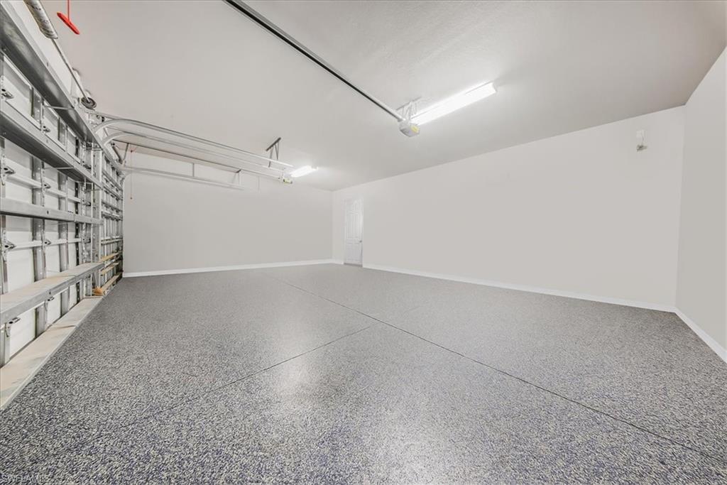 4616 Azalea Drive Naples, FL 34119 - Photo 37 of 44 Garage with baseboards