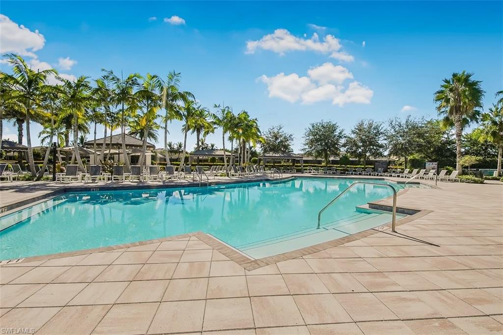 4616 Azalea Drive Naples, FL 34119 - Photo 41 of 44 Community pool with a patio area