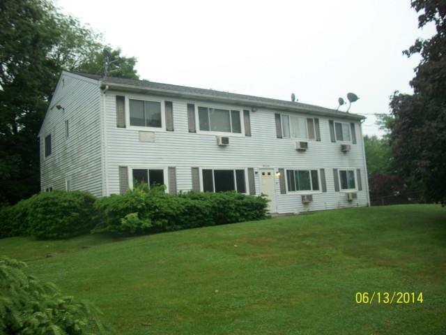 63 Academy Hill Road, Unit 63 Derby, CT 06418 - Photo 1 of 1 a front view of a house with a yard