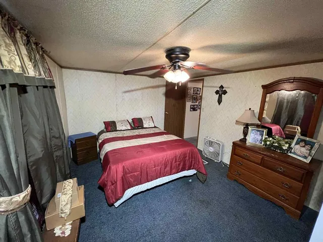 a bedroom with a bed and a walk in closet