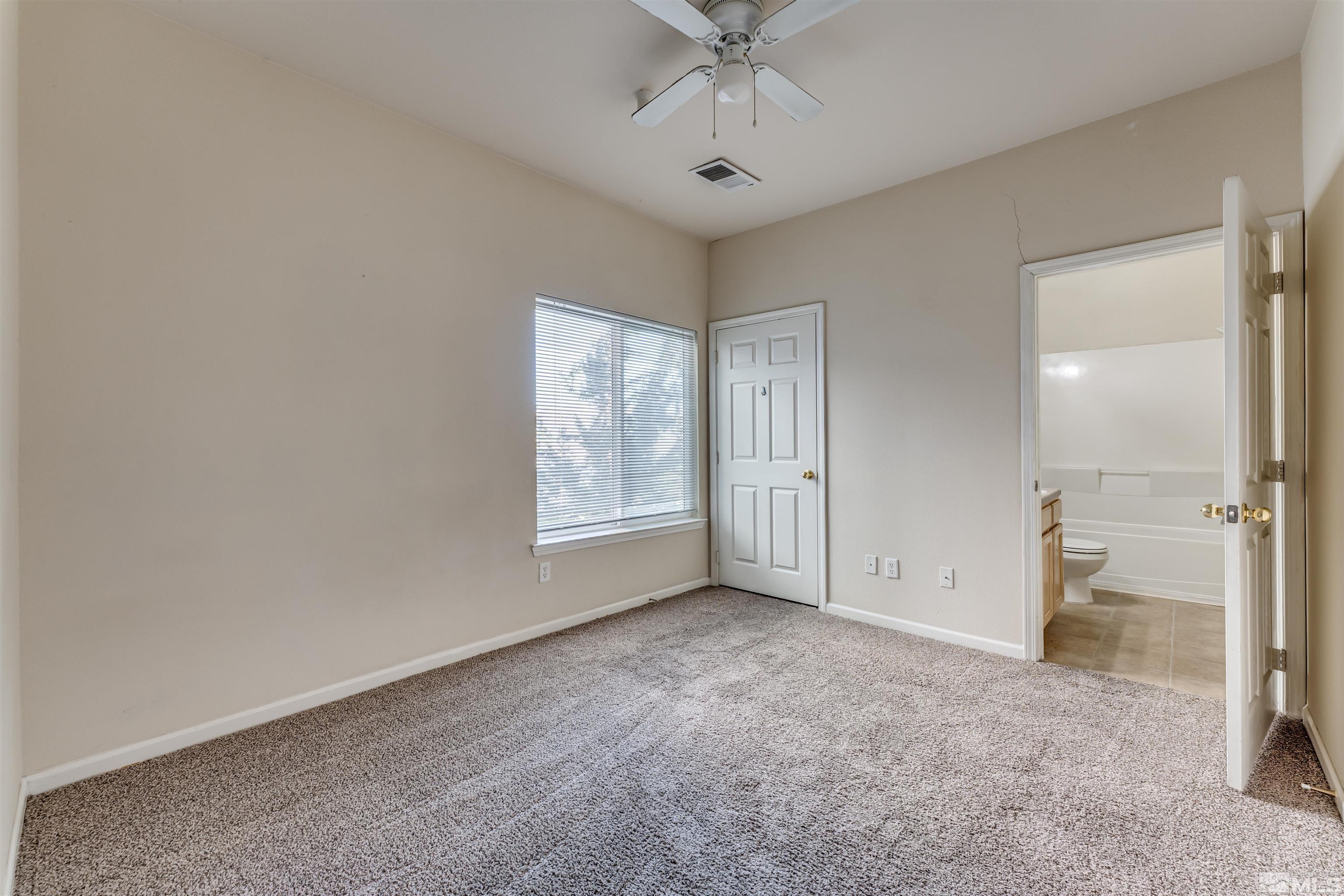 200 Talus Way, Unit 312 Reno, NV 89503 - Photo 14 of 33 wooden floor in an empty room with a window