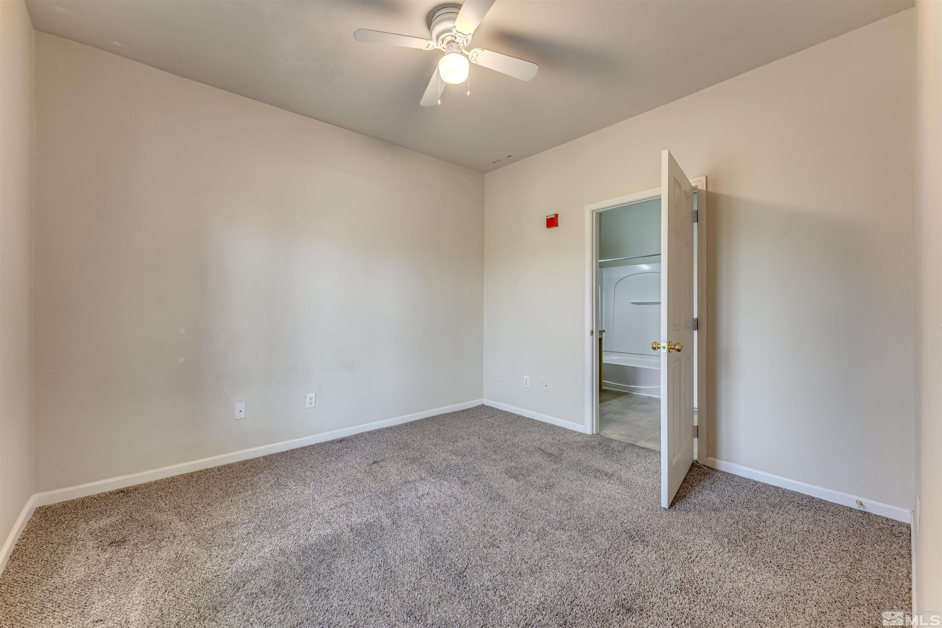 200 Talus Way, Unit 312 Reno, NV 89503 - Photo 20 of 33 an empty room with closet and a ceiling fan