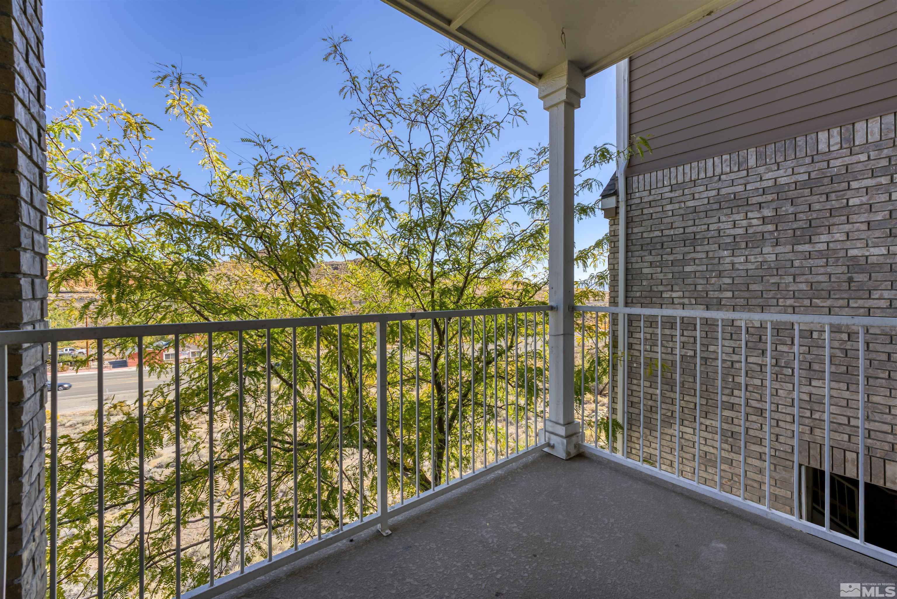200 Talus Way, Unit 312 Reno, NV 89503 - Photo 28 of 33 a view of balcony with lots of yellow lighting
