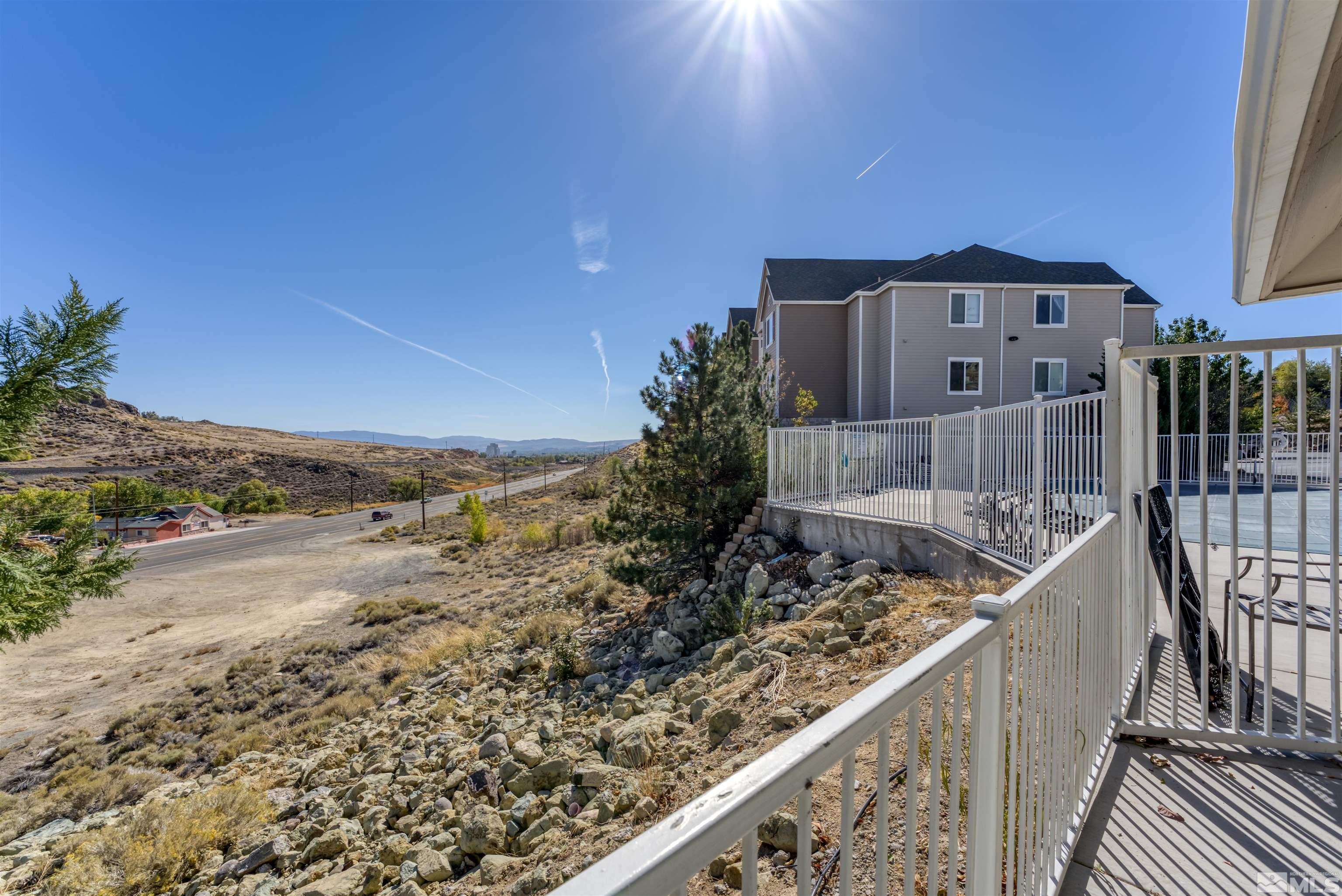 200 Talus Way, Unit 312 Reno, NV 89503 - Photo 33 of 33 a view of balcony with wooden floor and fence