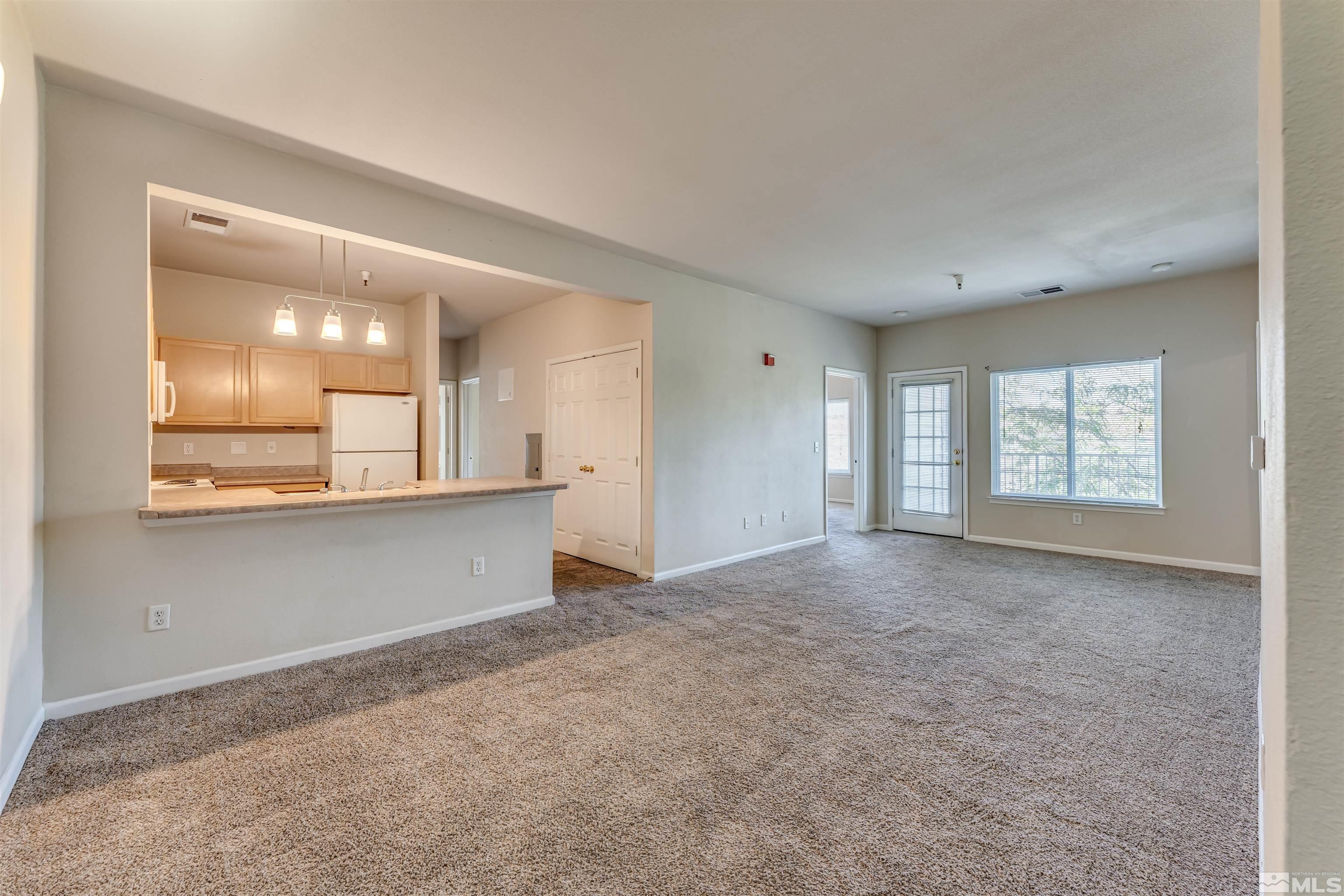 200 Talus Way, Unit 312 Reno, NV 89503 - Photo 5 of 33 a view of an empty room with a window