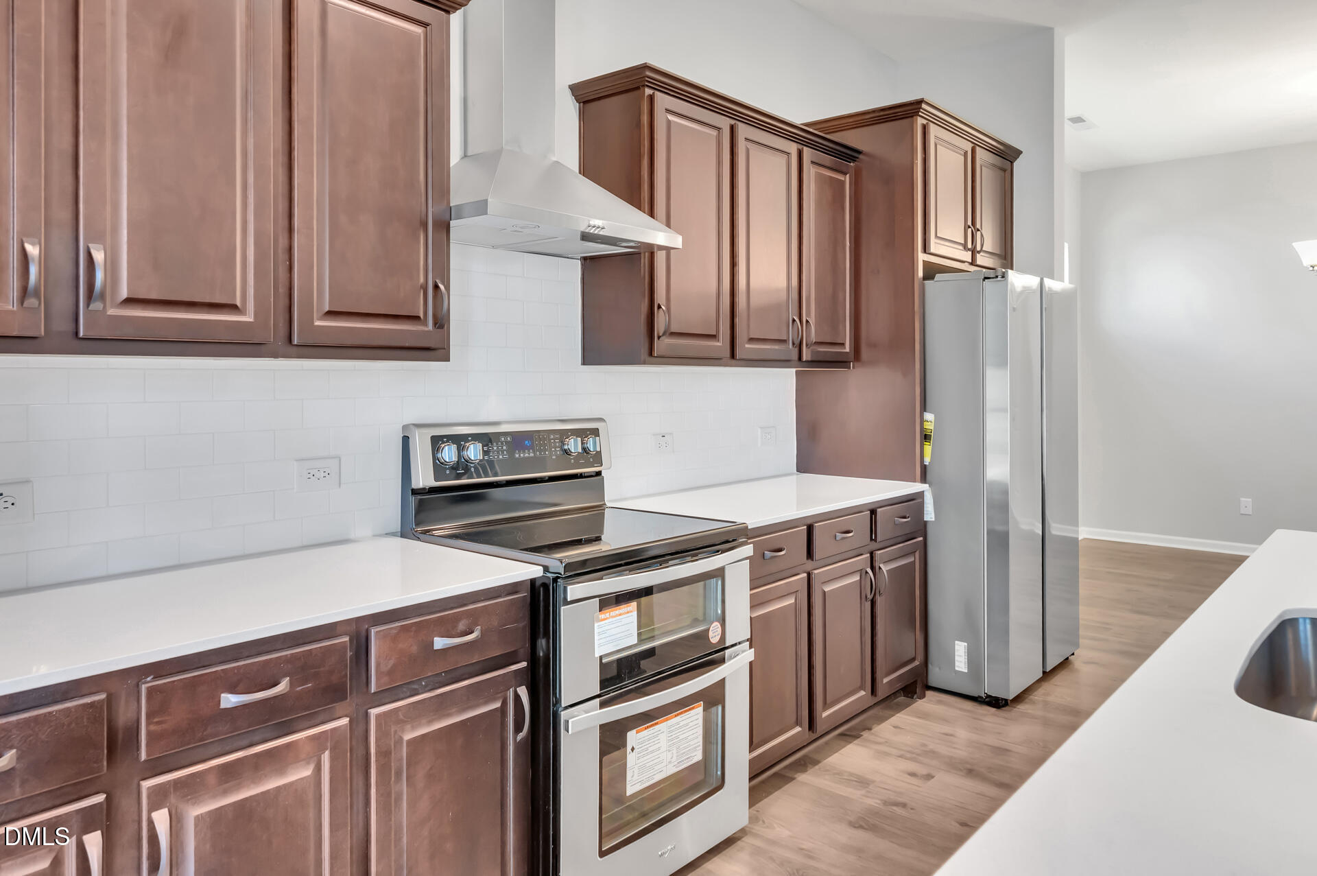 5406 Ripplebrook Drive Durham, NC 27712 - Photo 15 of 37 a kitchen with stainless steel appliances granite countertop a sink and a stove top oven