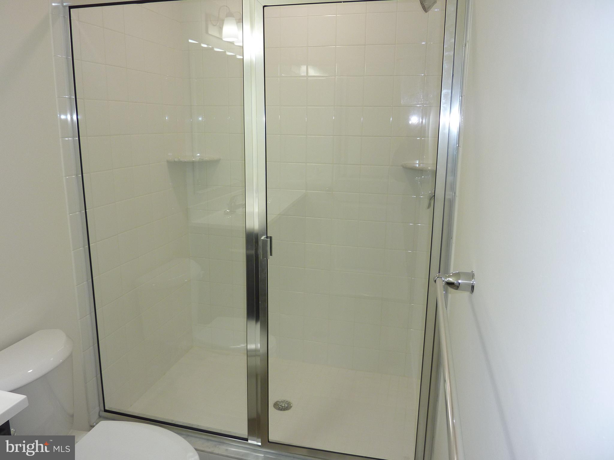 280 Doylestown Road Smyrna, DE 19977 - Photo 21 of 37 a bathroom with a shower and a toilet