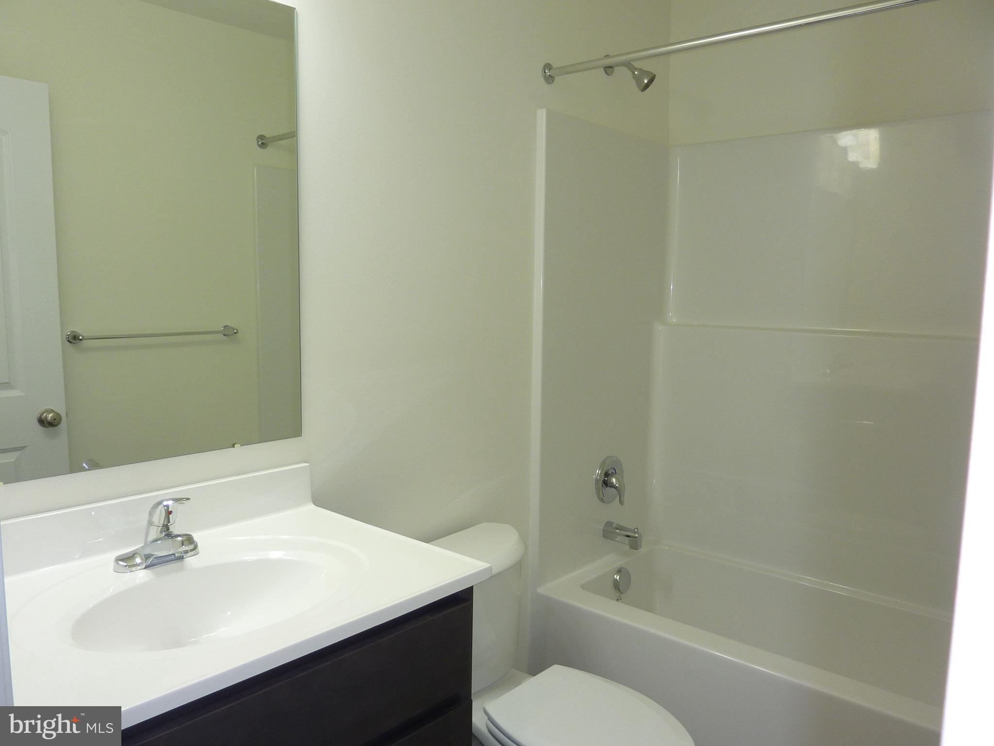 280 Doylestown Road Smyrna, DE 19977 - Photo 30 of 37 a bathroom with a sink toilet and shower
