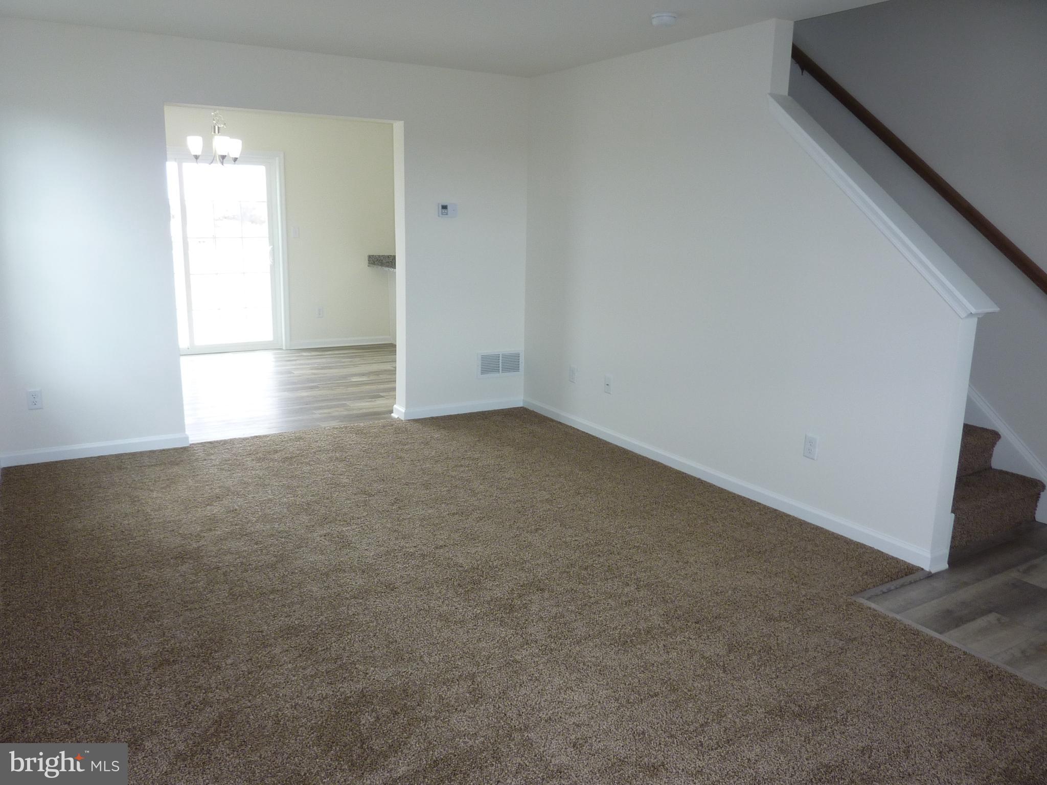 280 Doylestown Road Smyrna, DE 19977 - Photo 5 of 37 an empty room with windows and closet