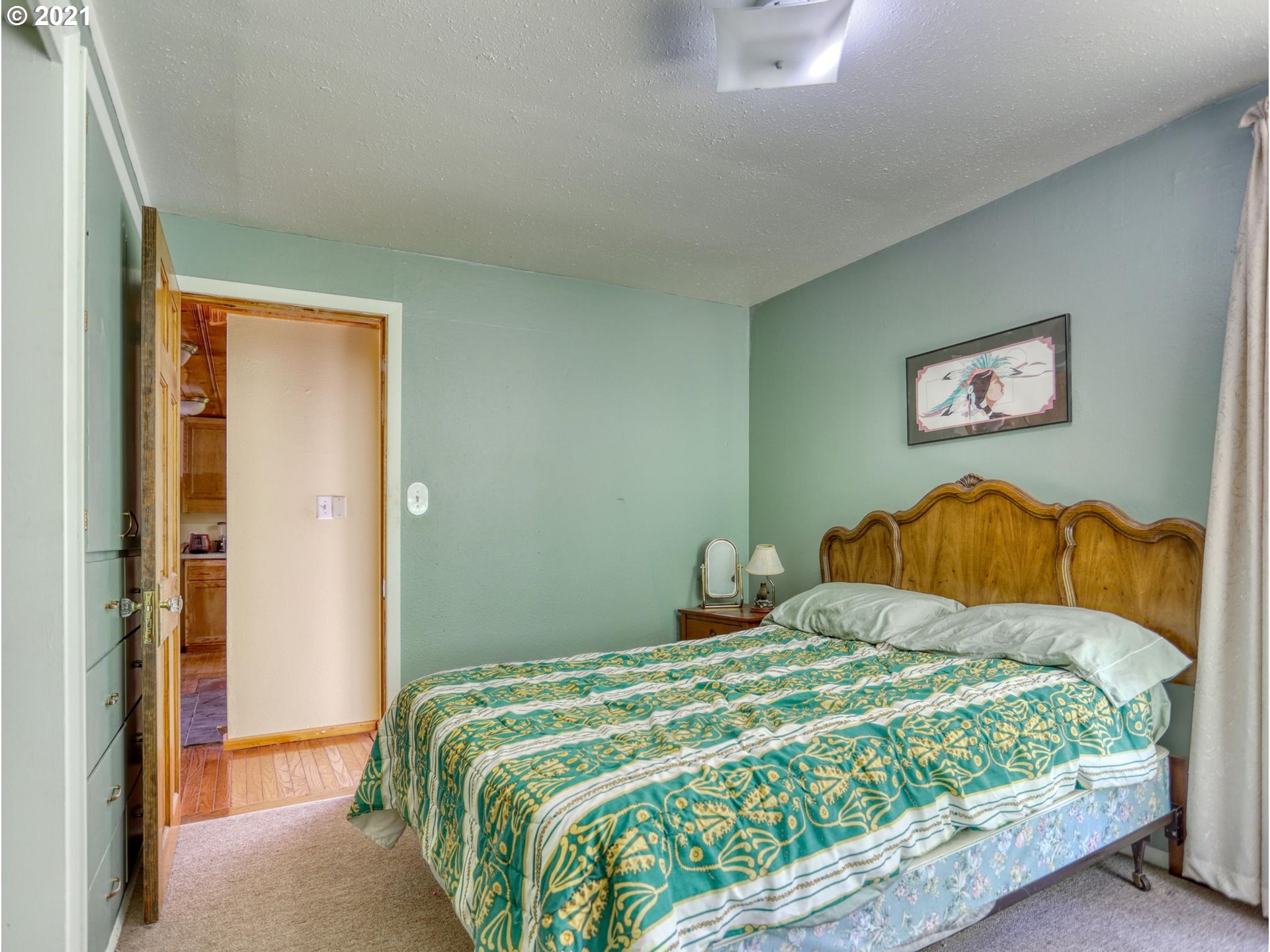 21070 Southeast Bornstedt Road Sandy, OR 97055 - Photo 12 of 31 a bedroom with a bed and painting on the wall