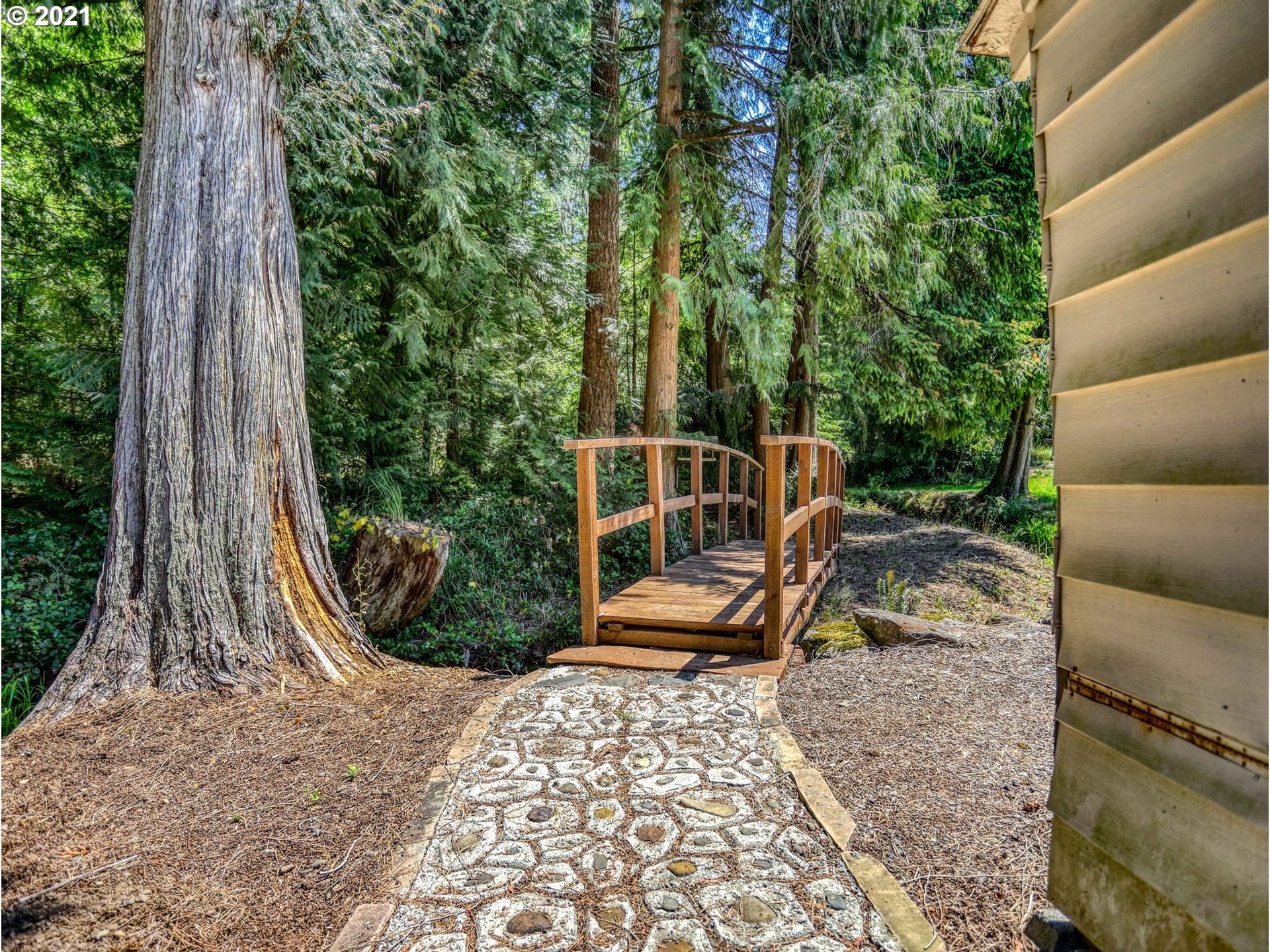 21070 Southeast Bornstedt Road Sandy, OR 97055 - Photo 20 of 31 a view of a bench in a backyard