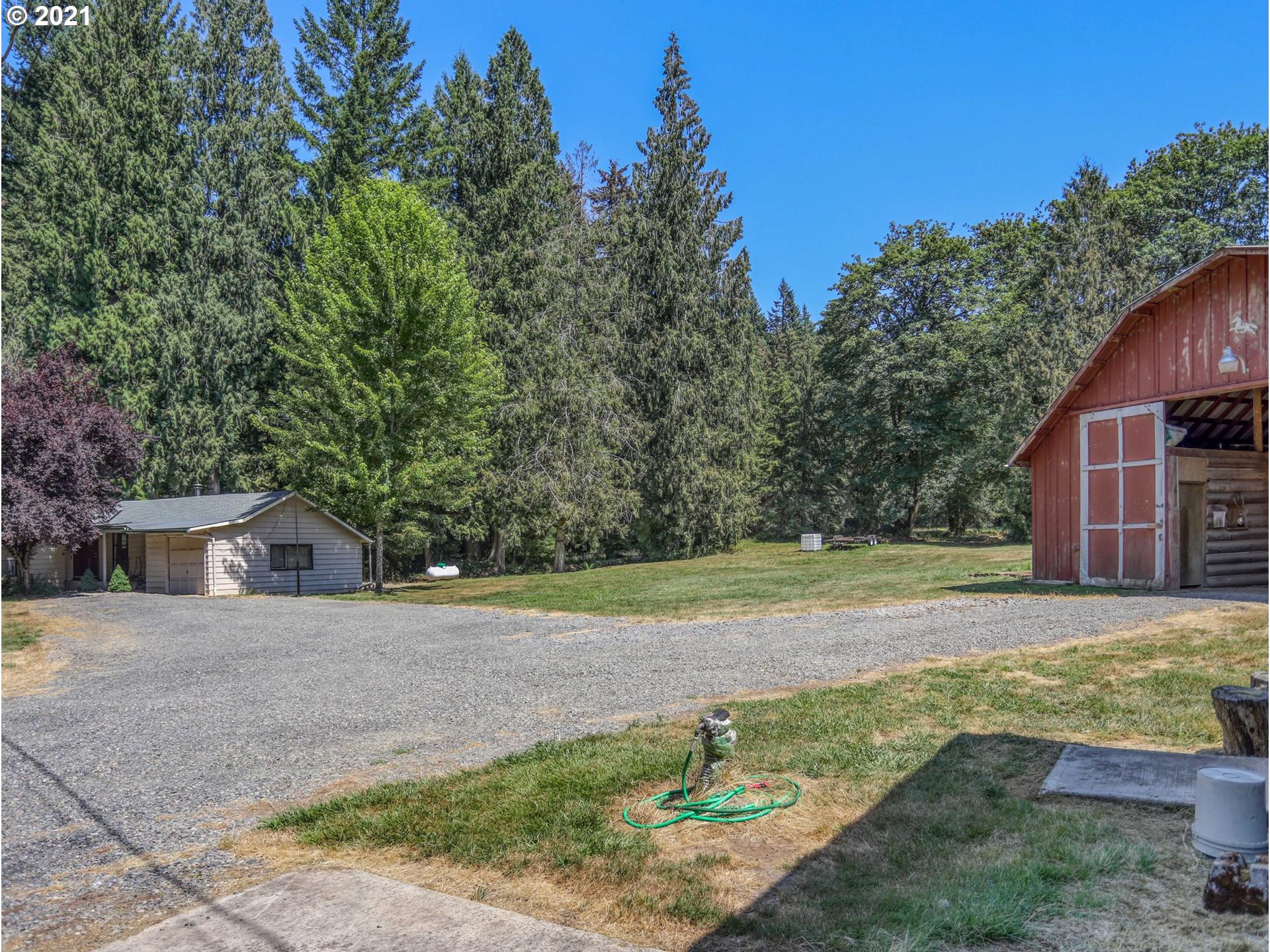 21070 Southeast Bornstedt Road Sandy, OR 97055 - Photo 30 of 31 a view of a backyard with large trees