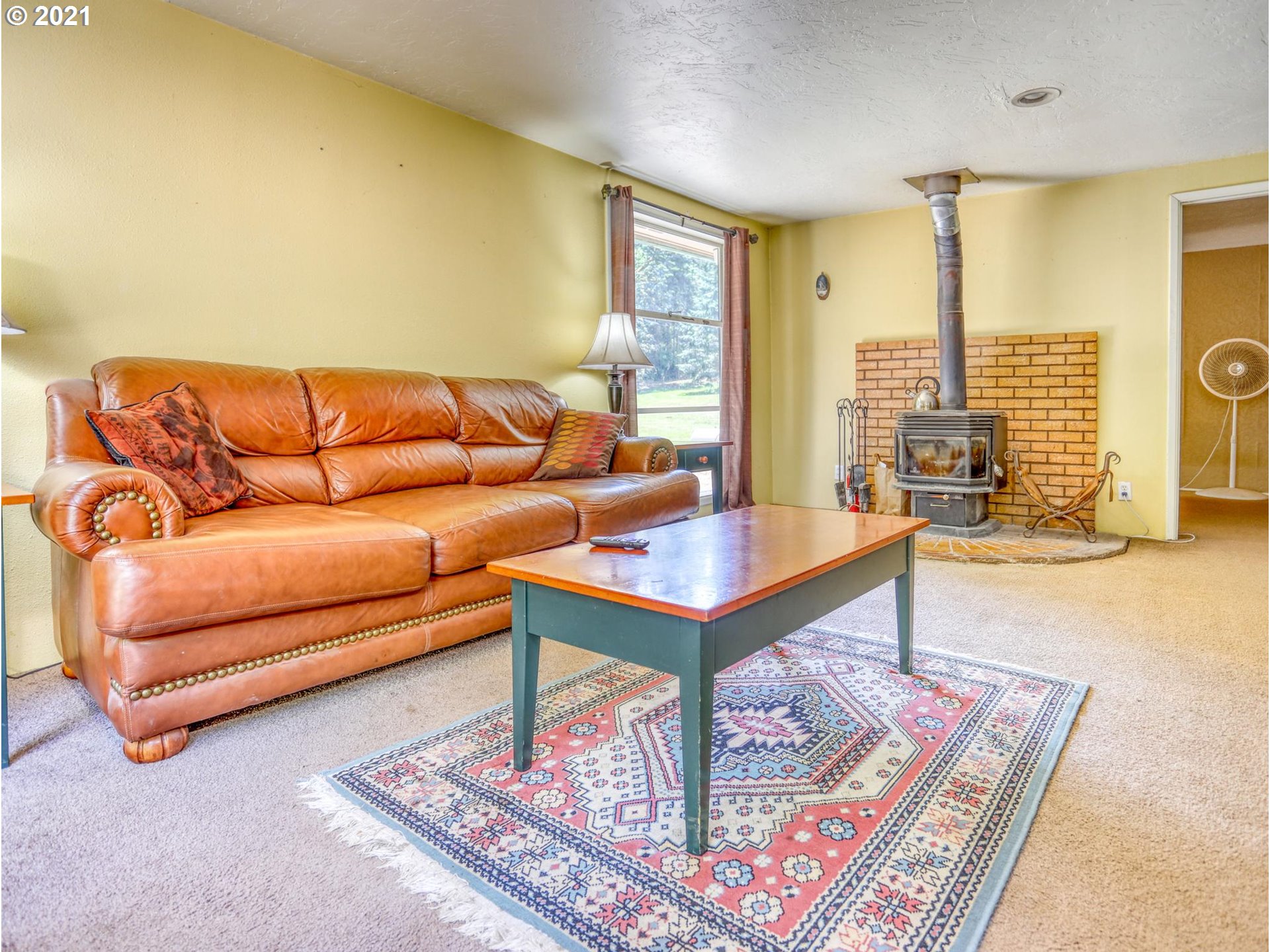 21070 Southeast Bornstedt Road Sandy, OR 97055 - Photo 4 of 31 a living room with furniture and a rug