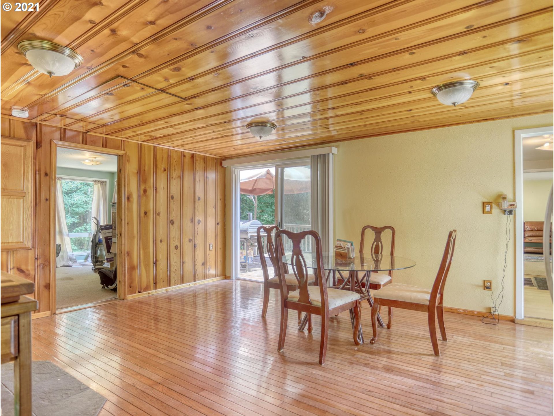 21070 Southeast Bornstedt Road Sandy, OR 97055 - Photo 7 of 31 a view of a dining room with furniture and wooden floor