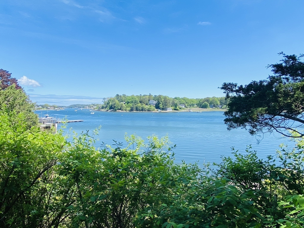 44 Ye Olde County Road Gloucester, MA 01930 - Photo 2 of 35 a view of a lake with a city