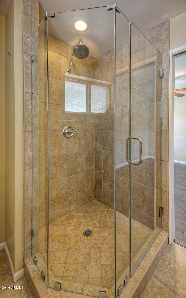 4831 East Osborn Road Phoenix, AZ 85018 - Photo 16 of 27 a bathroom with a shower