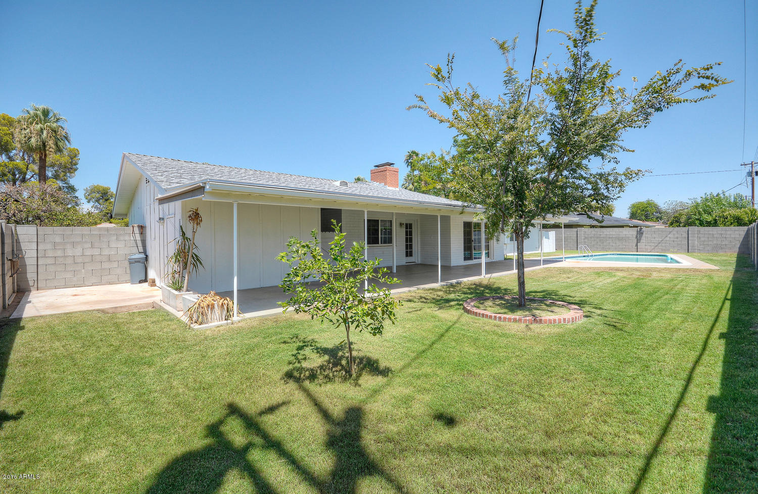 4831 East Osborn Road Phoenix, AZ 85018 - Photo 25 of 27 a view of a house with backyard and sitting area