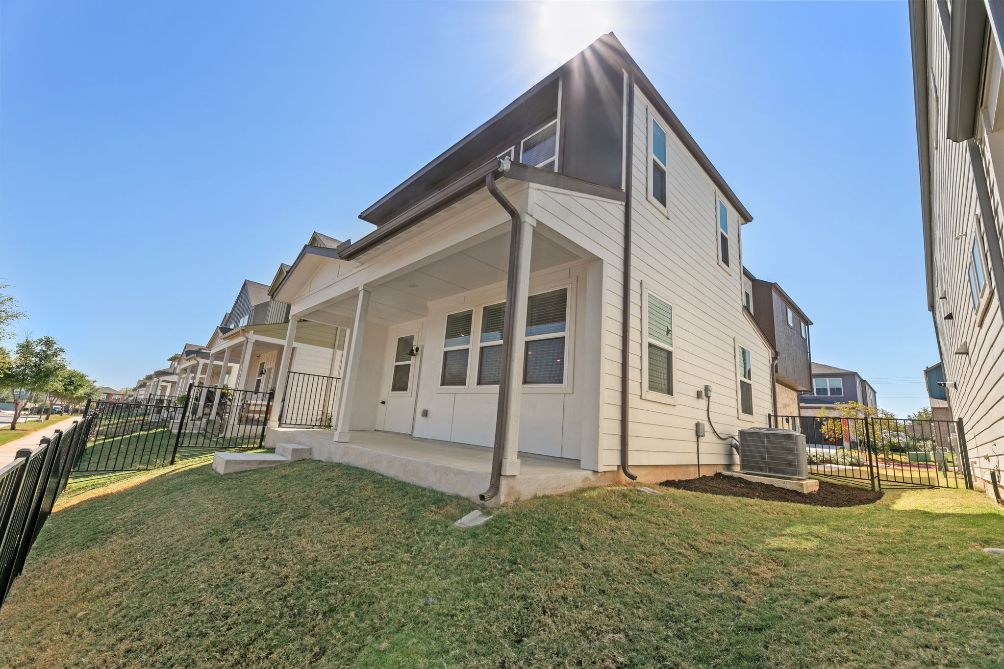 7312 Travertine Spring Drive Austin, TX 78744 - Photo 32 of 32 A contemporary residence with clean lines and a covered back porch, perfect for outdoor enjoyment.