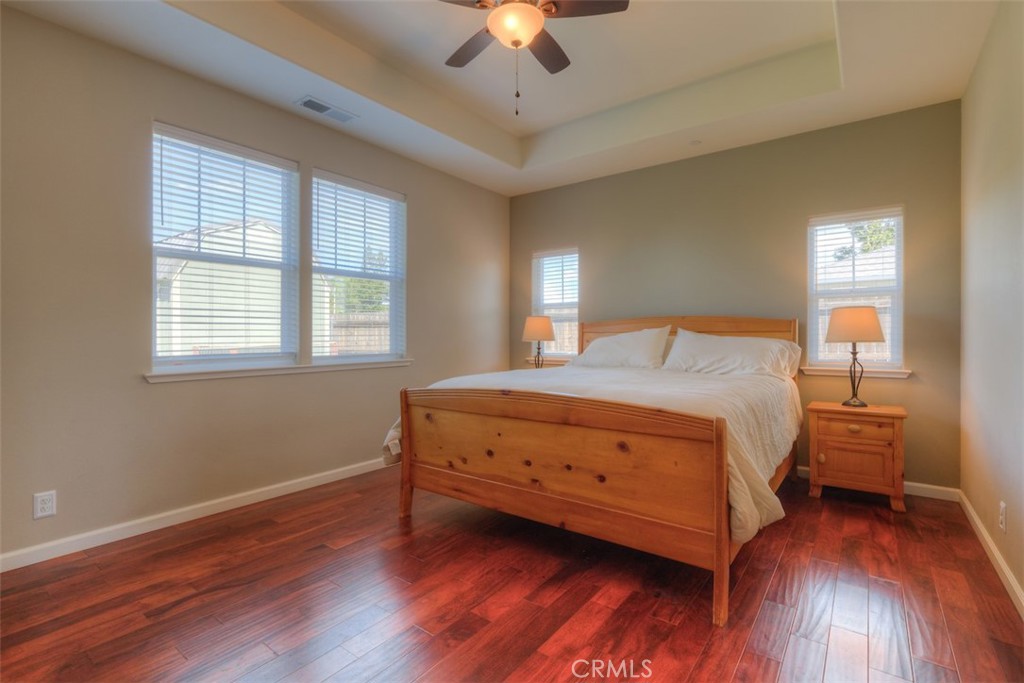 95 Sutter Road Paradise, CA 95969 - Photo 15 of 47 a bedroom with a bed and a chandelier