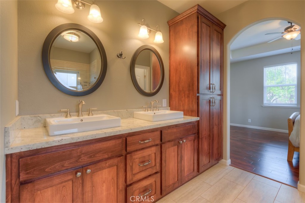 95 Sutter Road Paradise, CA 95969 - Photo 19 of 47 a bathroom with a granite countertop double vanity sink and a mirror
