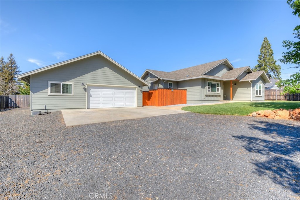 95 Sutter Road Paradise, CA 95969 - Photo 2 of 47 a front view of a house with a yard and garage