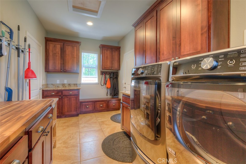 95 Sutter Road Paradise, CA 95969 - Photo 27 of 47 a kitchen with stainless steel appliances granite countertop a sink refrigerator and cabinets