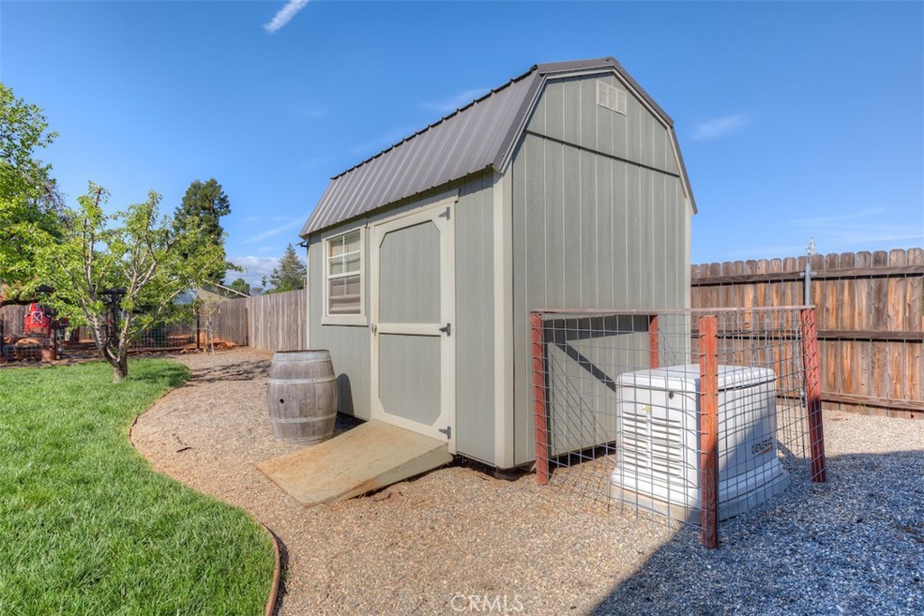 95 Sutter Road Paradise, CA 95969 - Photo 36 of 47 a view of a house with backyard and a garden