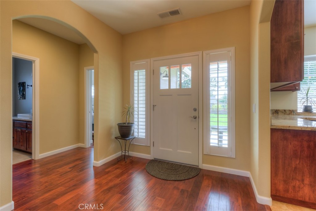 95 Sutter Road Paradise, CA 95969 - Photo 4 of 47 a view of an empty room with wooden floor and a window