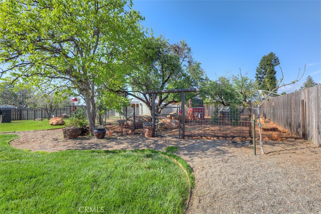 95 Sutter Road Paradise, CA 95969 - Photo 41 of 47 a view of a chair and table in backyard of the house