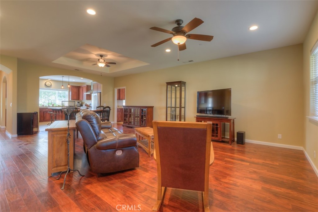 95 Sutter Road Paradise, CA 95969 - Photo 7 of 47 a living room with furniture kitchen view and a flat screen tv