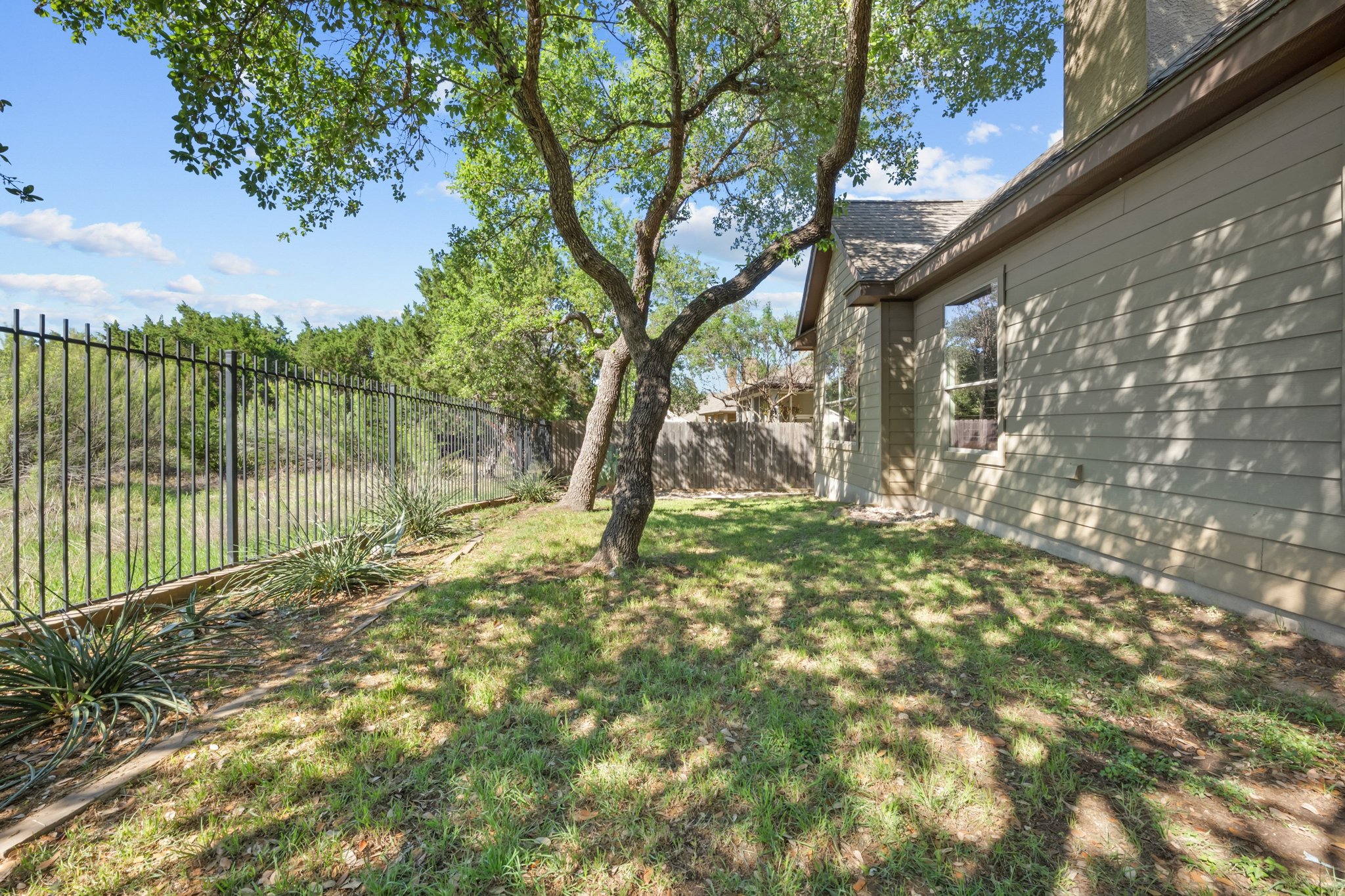 22204 Red Yucca Road Spicewood, TX 78669 - Photo 26 of 34 View of fenced backyard