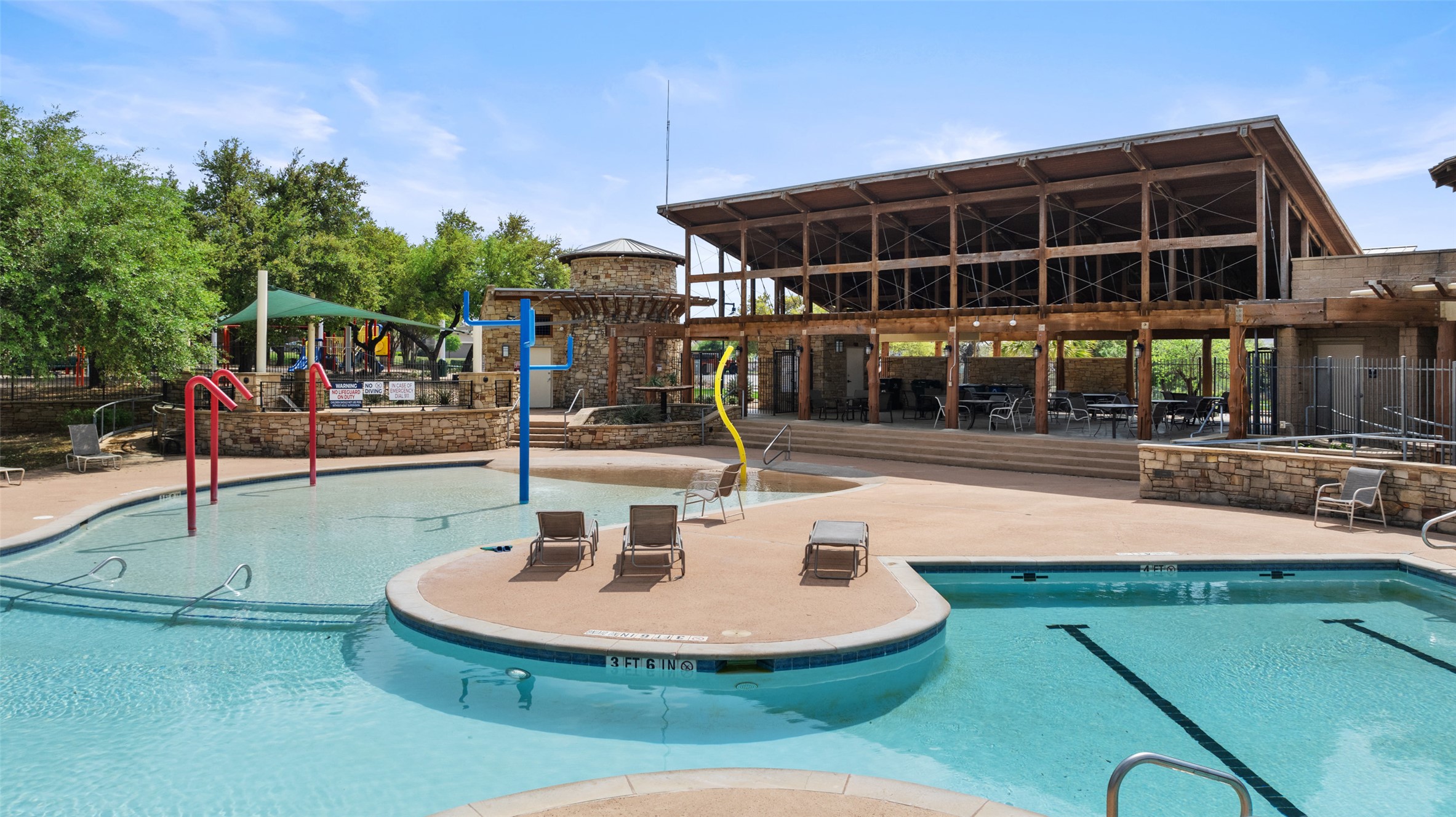 22204 Red Yucca Road Spicewood, TX 78669 - Photo 29 of 34 Community pool featuring a water play area and a patio area
