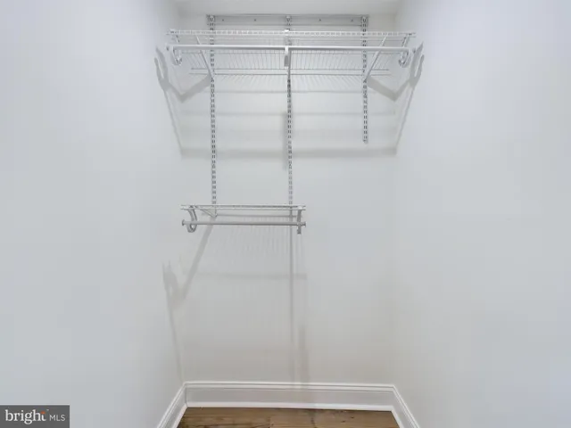 a view of a room with racks on the wall