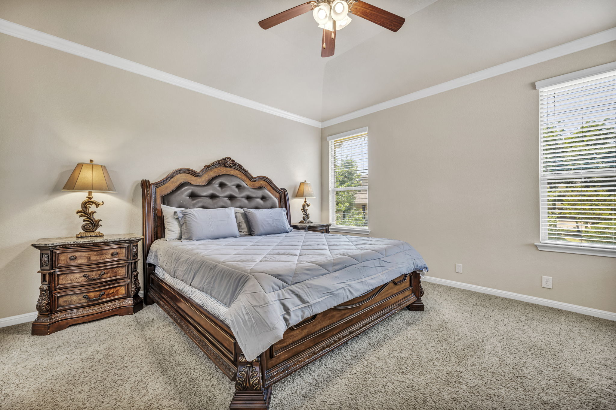 7320 Bandera Ranch Trail, Unit B Austin, TX 78750 - Photo 16 of 27 Primary Bedroom on second level with a ceiling fan, carpet, and crown molding