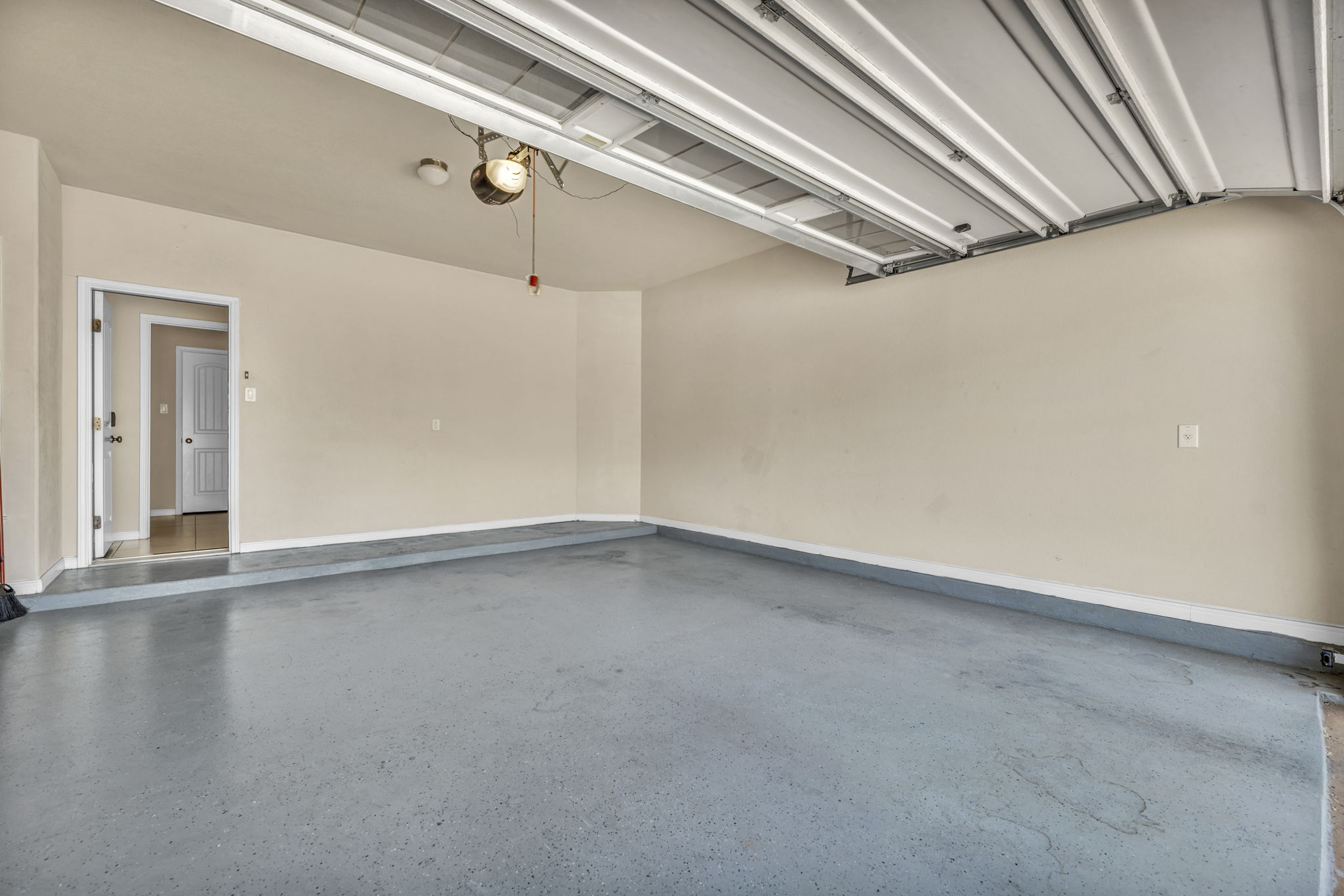 7320 Bandera Ranch Trail, Unit B Austin, TX 78750 - Photo 27 of 27 Garage featuring baseboards and a garage door opener
