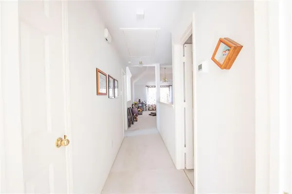 a view of a hallway with a white walls