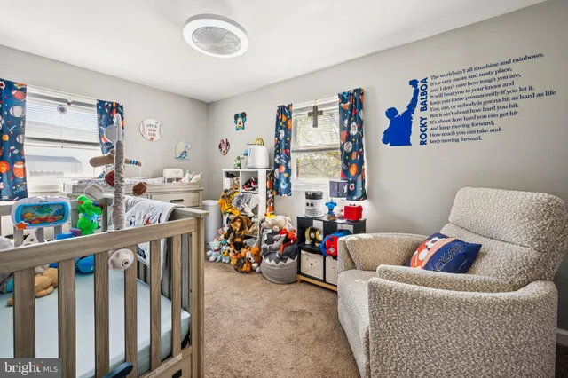 a children room with furniture and toys