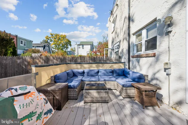 a view of a couches and dinning table in patio