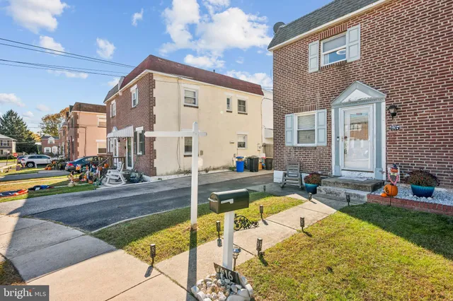 a view of a house with swimming pool and sitting area