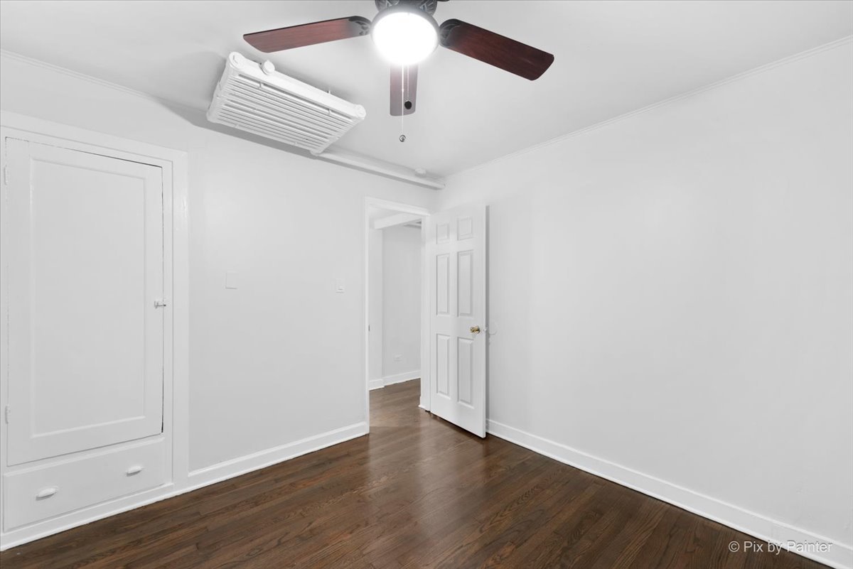 5428 North Campbell Avenue, Unit GS Chicago, IL 60625 - Photo 11 of 14 wooden floor in an empty room