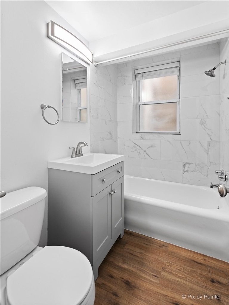 5428 North Campbell Avenue, Unit GS Chicago, IL 60625 - Photo 10 of 14 a bathroom with a sink a toilet and shower