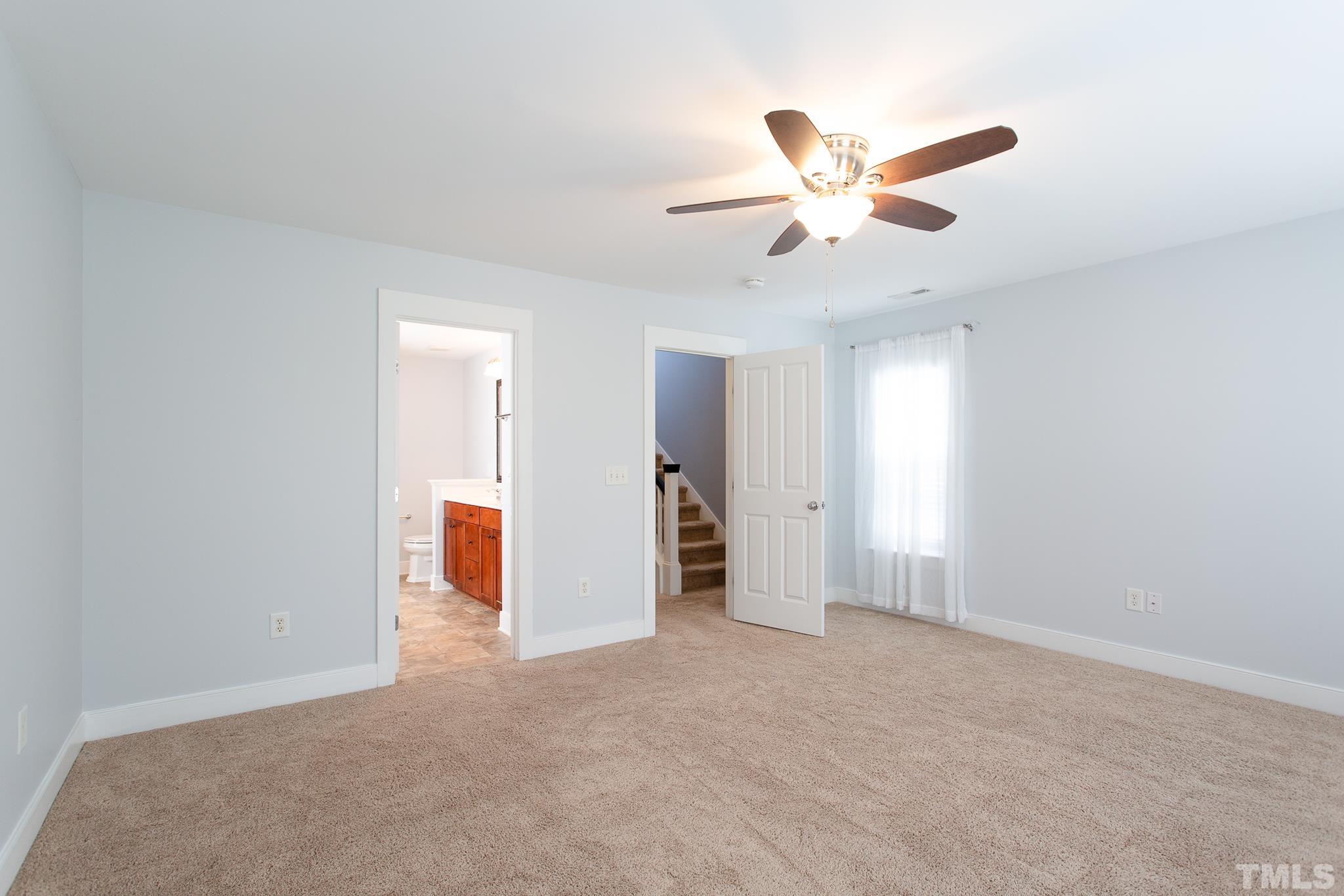 2262 Dunlin Lane Raleigh, NC 27614 - Photo 17 of 27 a view of an empty room and window ceiling fan