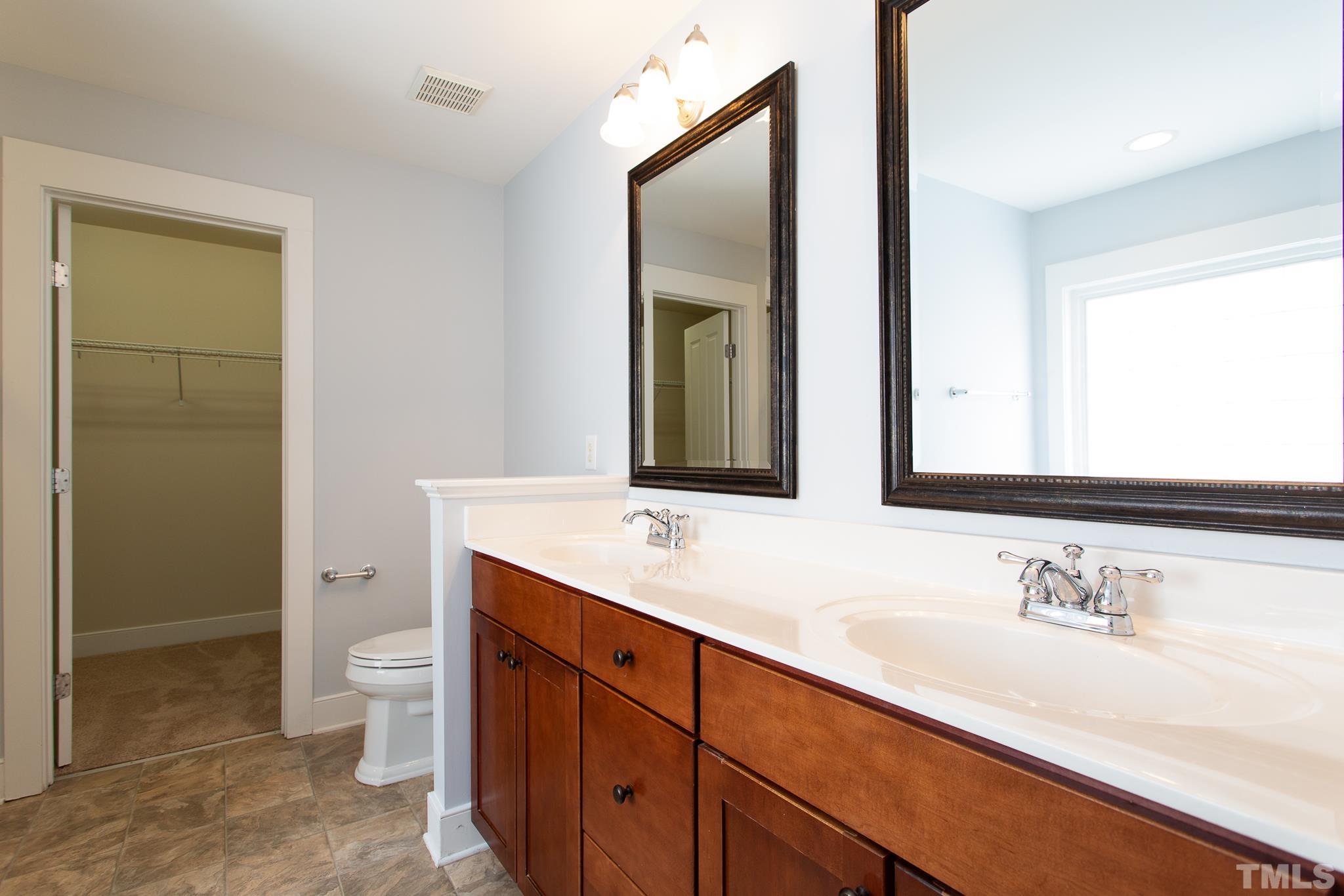 2262 Dunlin Lane Raleigh, NC 27614 - Photo 20 of 27 a bathroom with a sink a toilet and shower