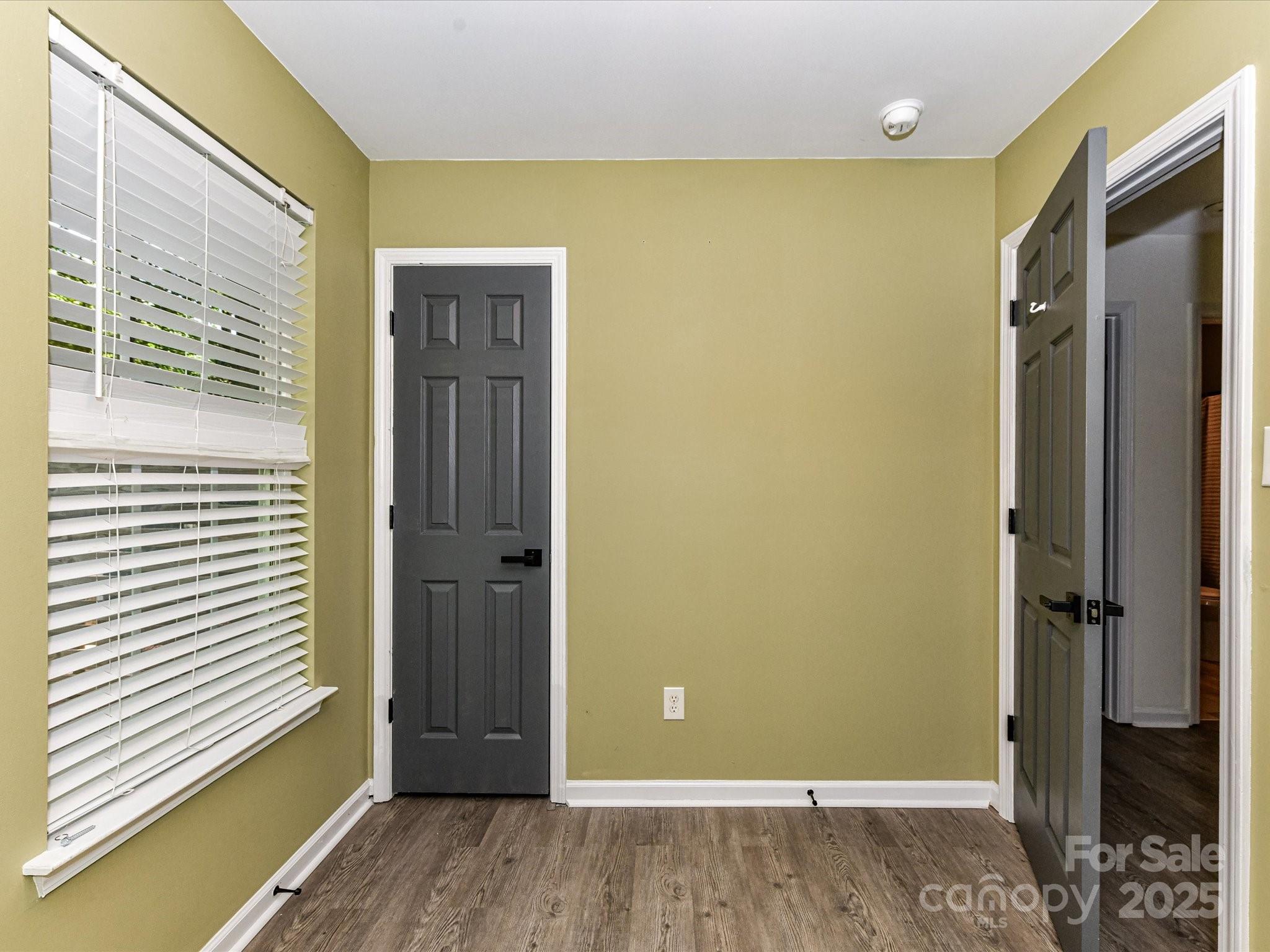 12224 Lullingstone Road Pineville, NC 28134 - Photo 16 of 26 a view of a hallway with wooden floor and closet area